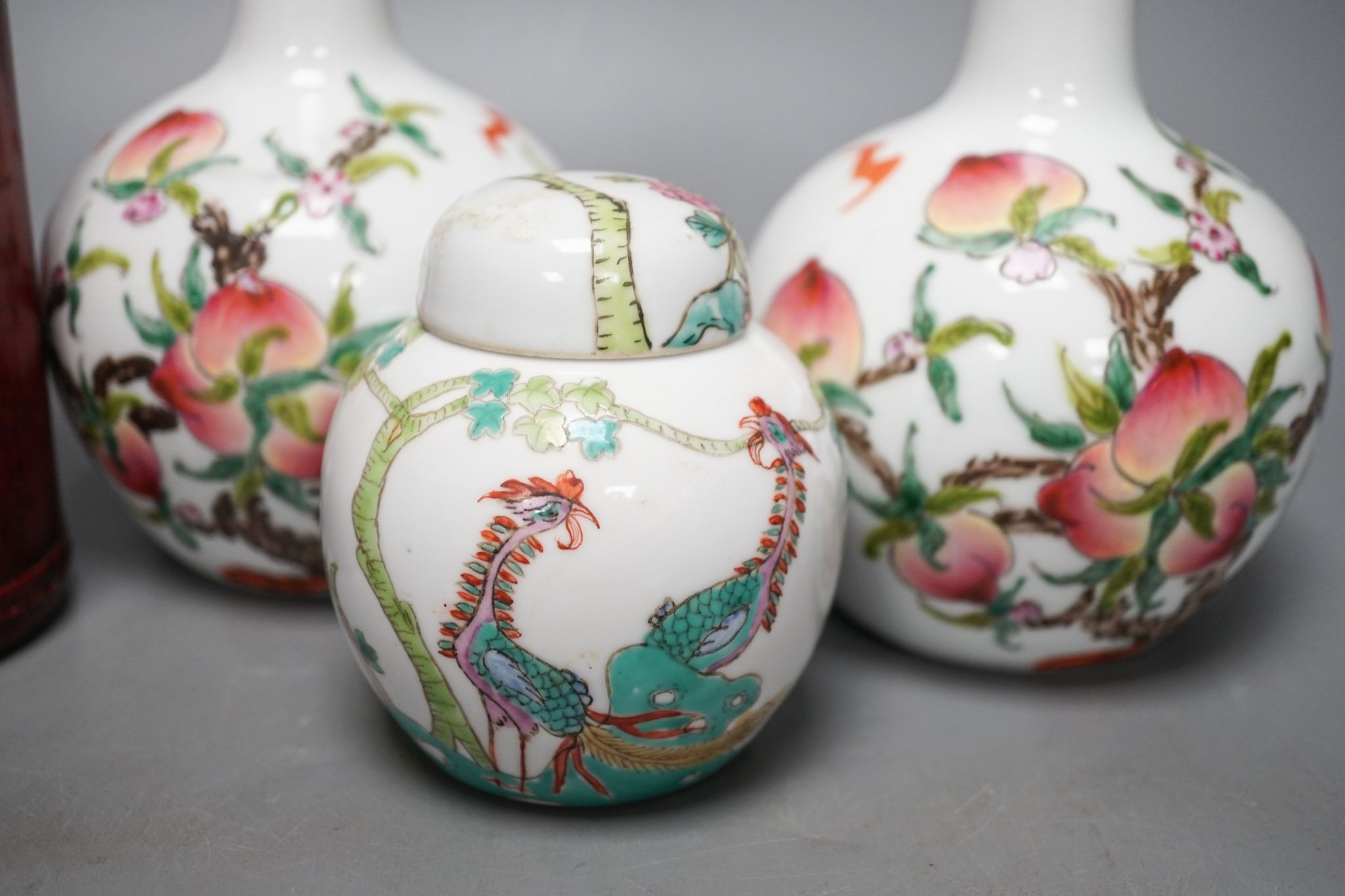 A pair of Chinese famille rose ‘peach’ bottle vases, 17cm, a ‘phoenix’ jar and cover, two porcelain cups and a boxed set of bamboo tallies or counters (6)